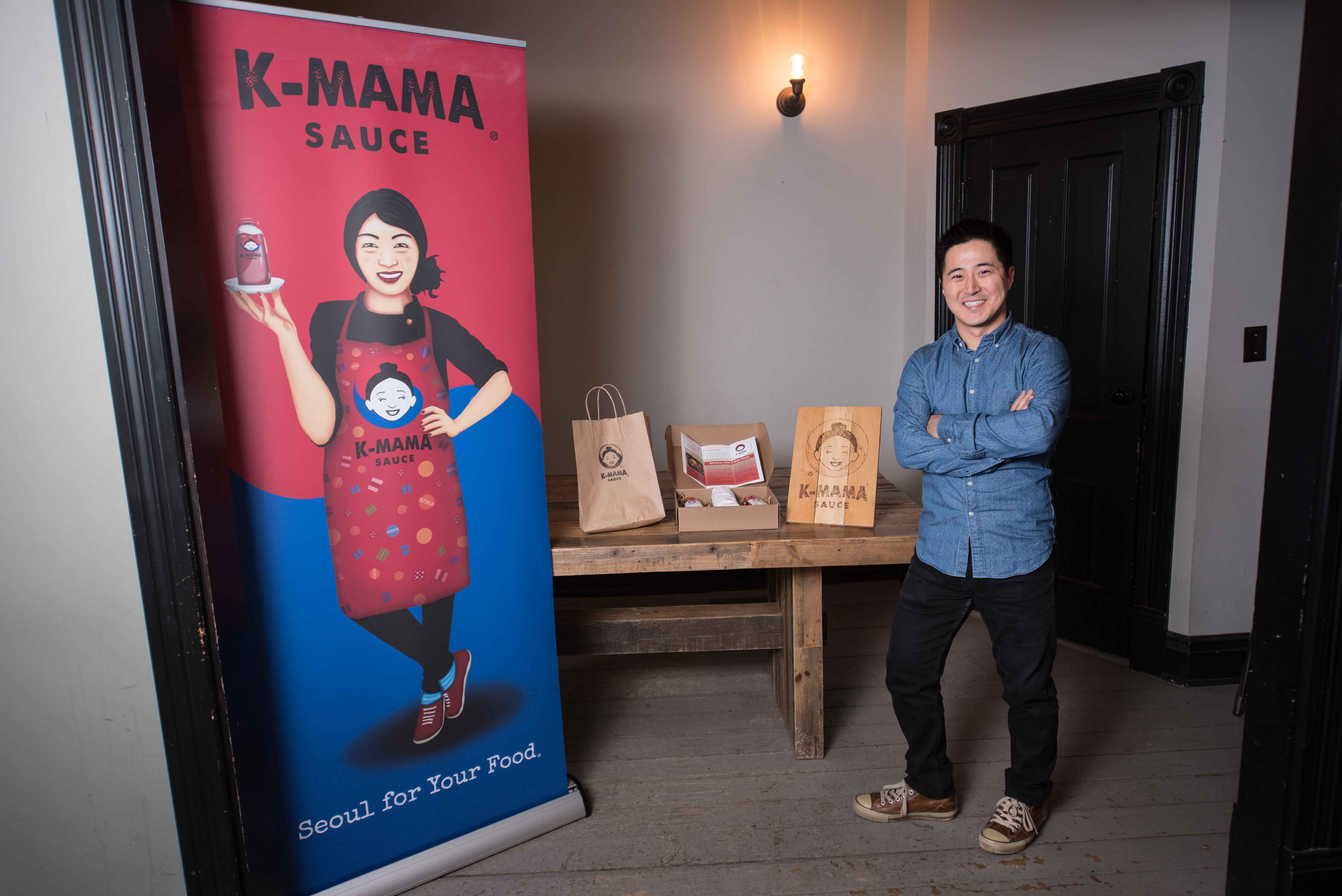 K-Mama sauce owner standing by product
